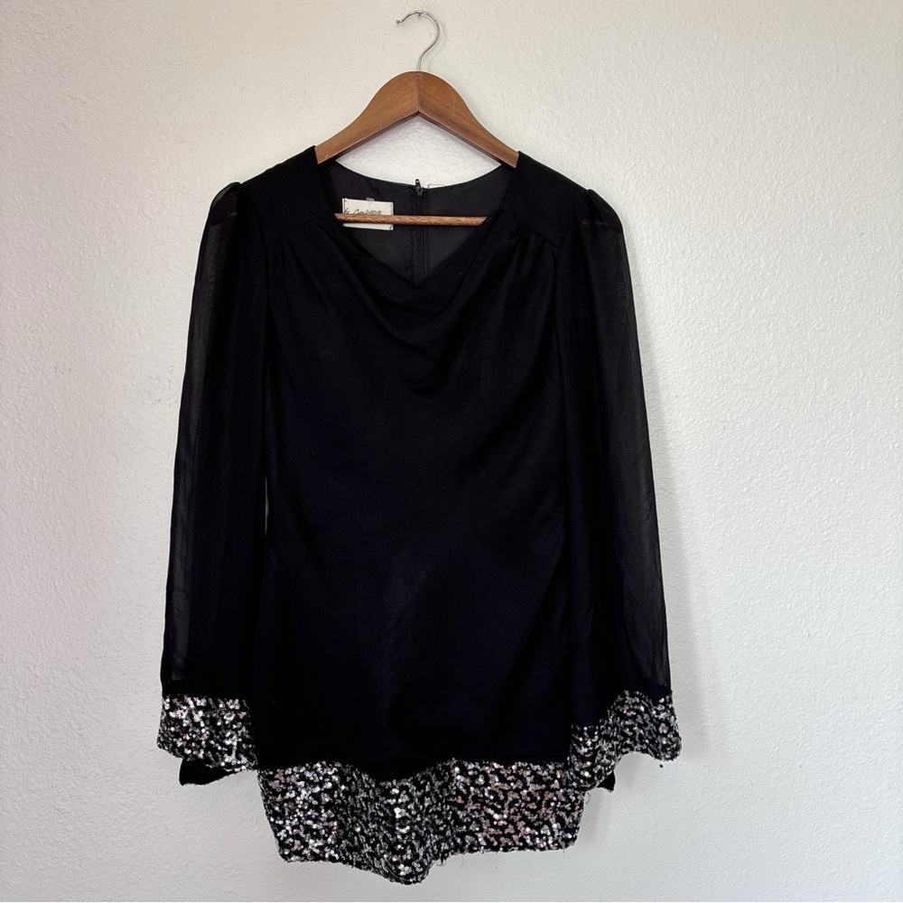 Elegant Black Long Sleeve Dress with Patterned Hem